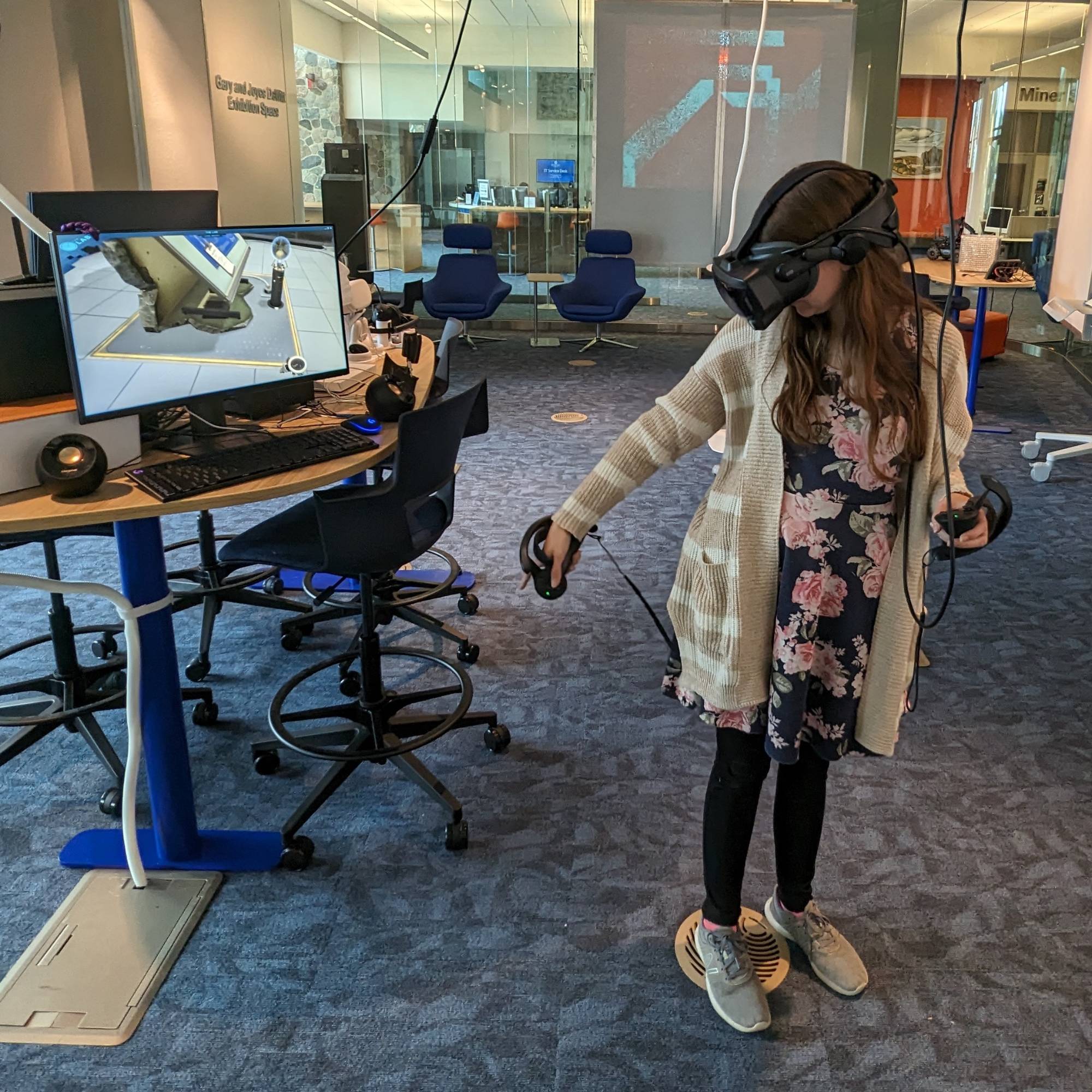 Student wearing the Valve Index in the Exhibition Space.